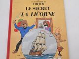 an old children ' s book about the adventures of tintin and the secret of a licorne