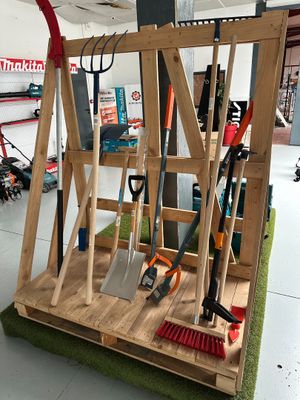 a display of gardening tools on display in a garage