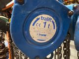 a close up of a blue gate with chains attached to it