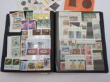 a black folder with stamps on it and a picture of an elephant