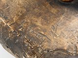 a close up of a wooden sculpture of a bird