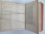 an open book with a diagram of a line of lines on it