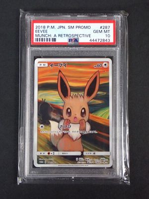 a close up of a pokemon trading card on a black surface