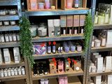 many different types of products on the shelves in the store