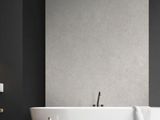 black and white bathroom with a freestanding bathtub