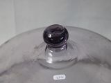 a glass lid on a glass container on a table