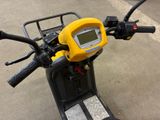 a motorcycle with a yellow and black handlebars and a yellow and black handlebar