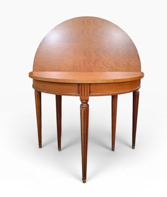 a round table with a wooden top and legs