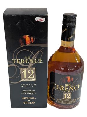 an image of a bottle of whisky sitting next to a box