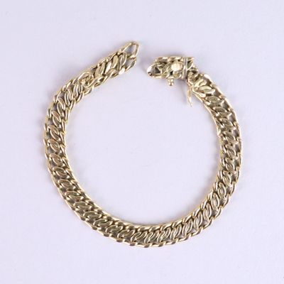 bracelet à chaîne plaqué or avec un fermoir en forme de tête de lion