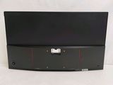 the back panel of a black laptop computer with a red stripe on it