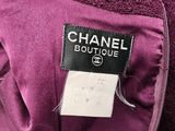 a close up of a purple jacket with a label on it