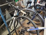many bicycles that are parked in a garage