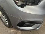 a close up of a car ' s headlight and front bumper