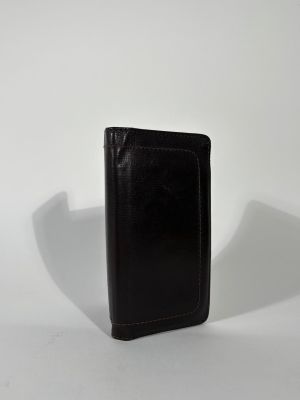 LOUIS VUITTON Portefeuille en cuir brun surpiqué. 9,8 x 18 c…