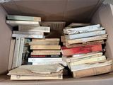 a box full of books sitting on top of a table