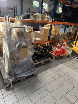 a large pile of boxes on a pallet in a warehouse
