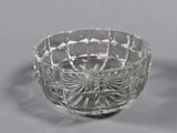 pair of cut glass bowls on a grey background