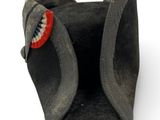 a black hat with a red button on it