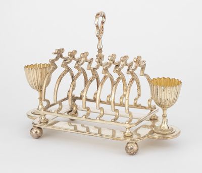 a silver plated menorat with five candles and a candle holder