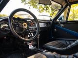 the interior of a car with a steering wheel and leather seats