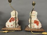 pair of antique chinese porcelain dogs on wood bases with red and white paint