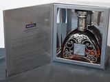 a bottle of liquor in a box on a table