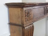 a wooden table with a marble top in the corner of a room