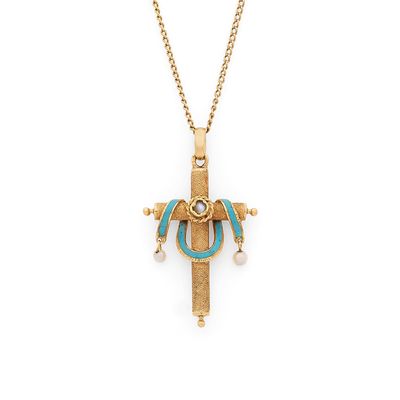 un collier en or et turquoise orné d'une croix