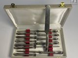 a silver case with a set of tools in it