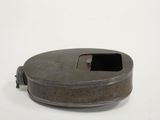a metal container with a hole in it on a white surface
