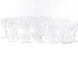 a lot of wine glasses that are sitting on the table