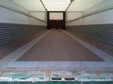 an image of the inside of a moving truck with its doors open