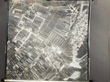 a black and white photo of a map of a city