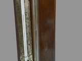 a close up of a door handle on a wooden door