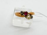 a ring that is sitting on top of a piece of glass