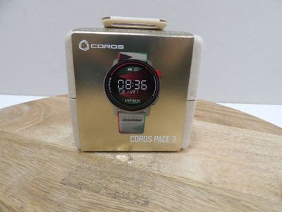 a clock that is sitting on top of a wooden table