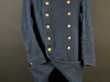 a blue military coat with gold buttons and a red collar