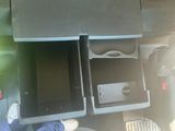 a laptop in the open compartment of a car