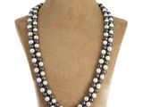 a close up of a necklace on a mannequin mannequin