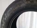 a close up of a tire on a white surface with a white background