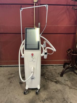 an image of a machine that is sitting in front of a red wall