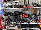 many different types of tools on the shelves in the garage