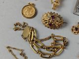 a lot of jewelry that is laying out on the table