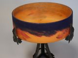 a bowl that is sitting on a stand on a table