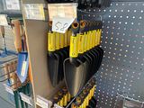 many different tools on the shelf in the store