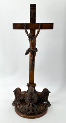 a wooden cross with a crucifix on top of it