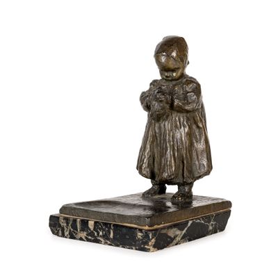 bronze statue of a little girl holding a cat on a marble base