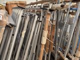 several pieces of metal are stacked up in a warehouse