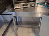 a toaster that is sitting on a table in a kitchen